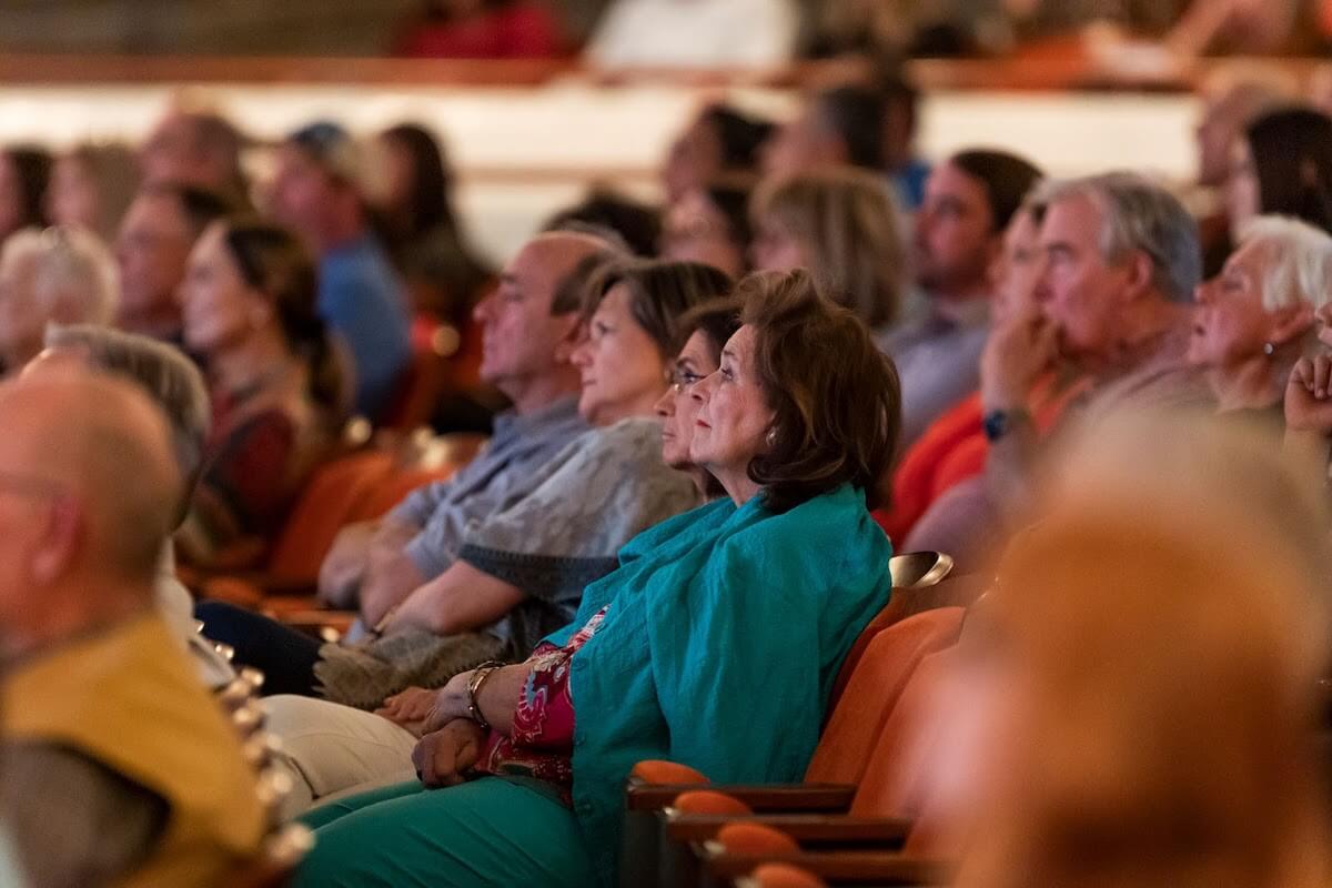 Participants watching Robert M. Edsel speak during a Distinguished Lecture Event