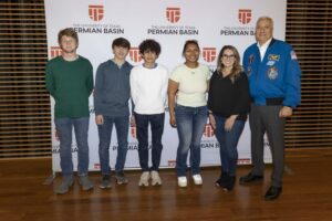 A photo of students taking a photo alongside Mike Massimino