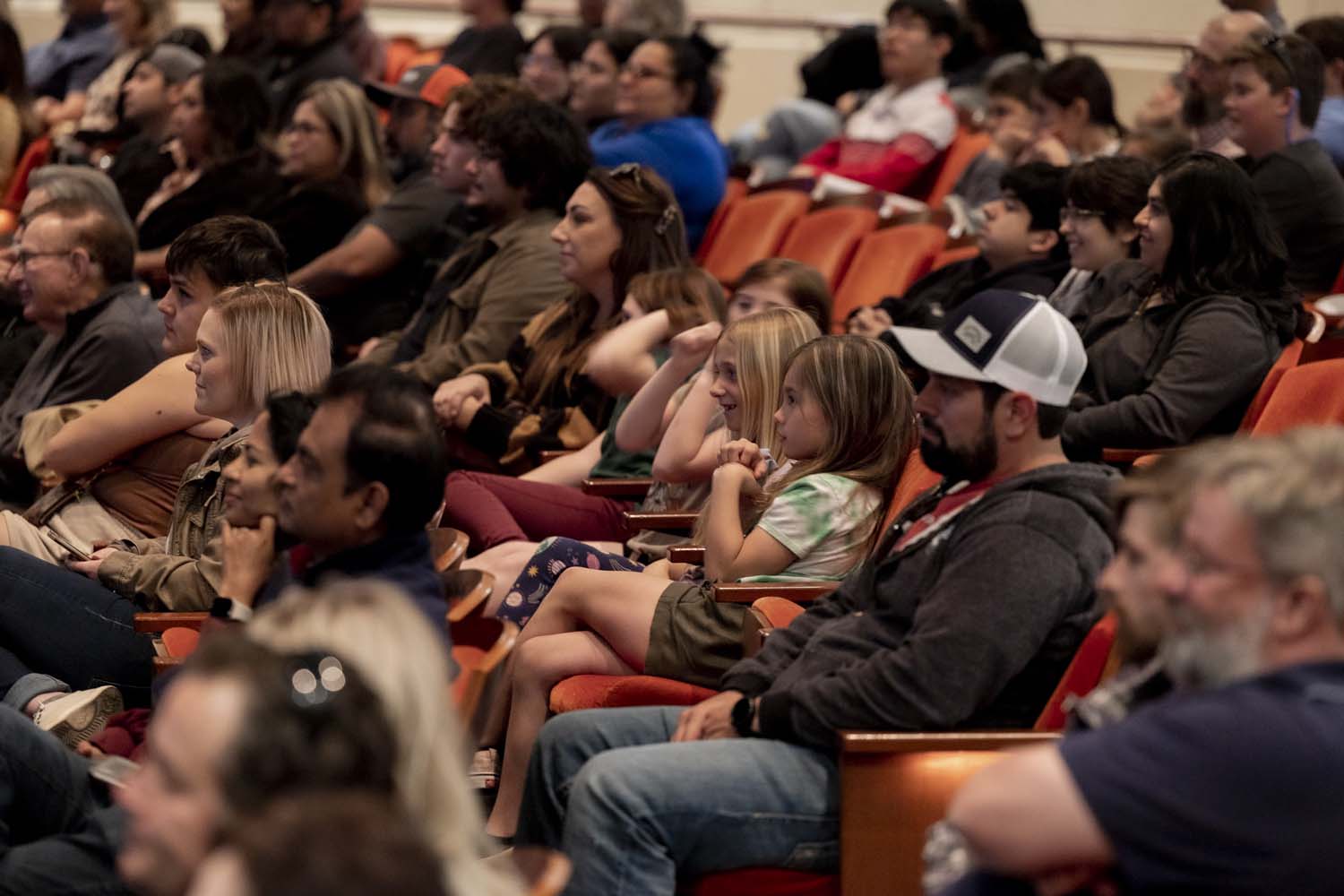 The audience listening to a speaker during a Distinguished Lecture Series event