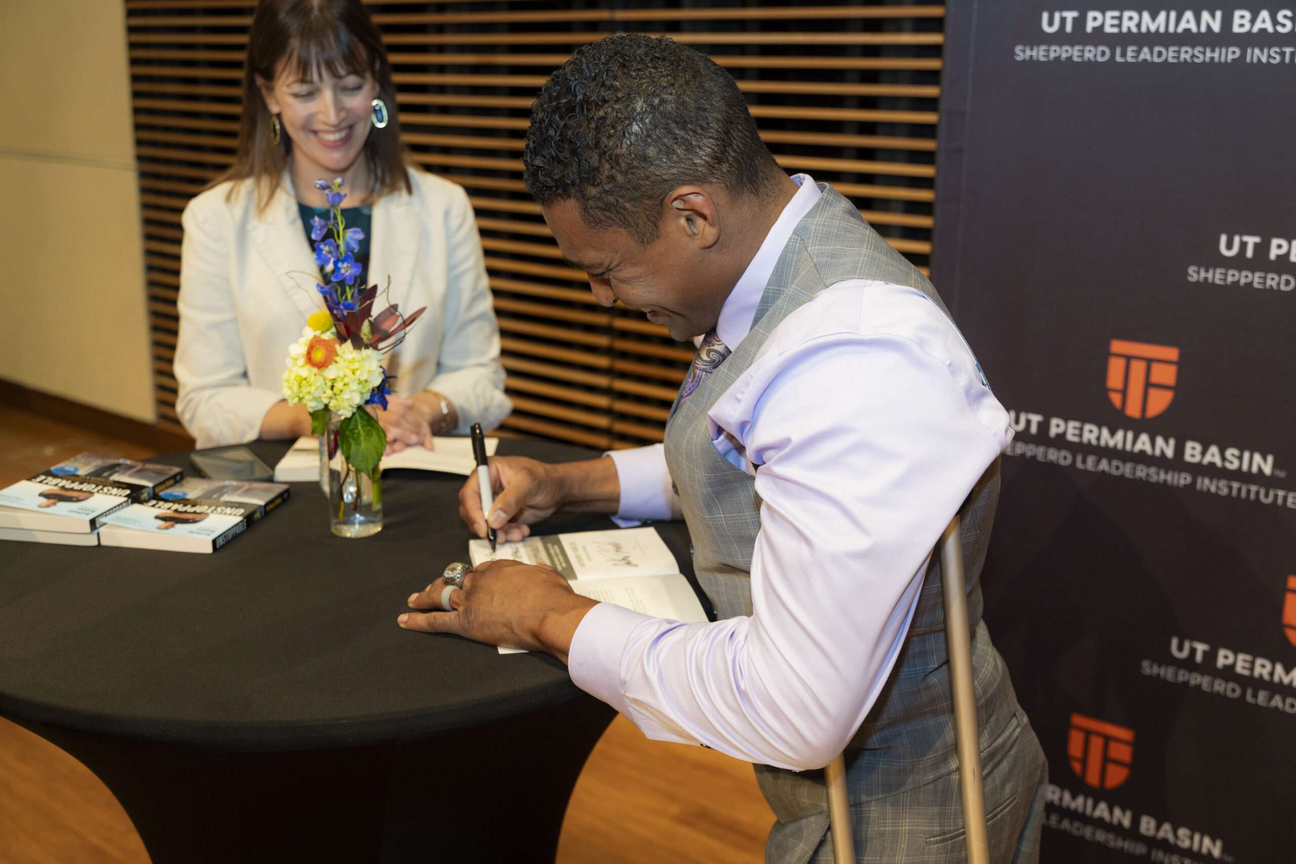 Robert M. Edsel standing at a podium